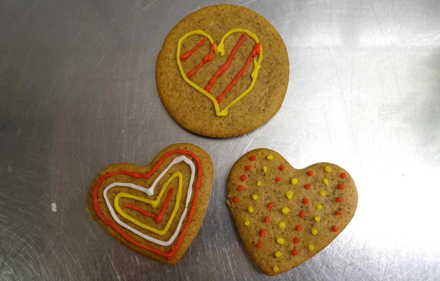 Ginger cookies decorated with colored hearts photo