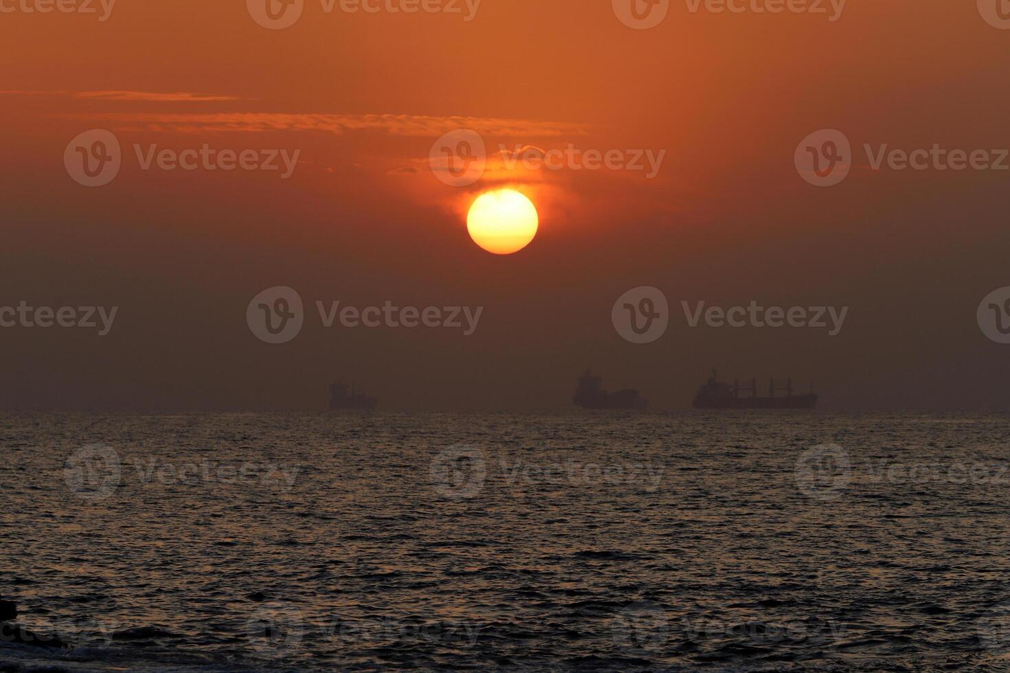 Lighting and color of the sky above the horizon at sunset. photo