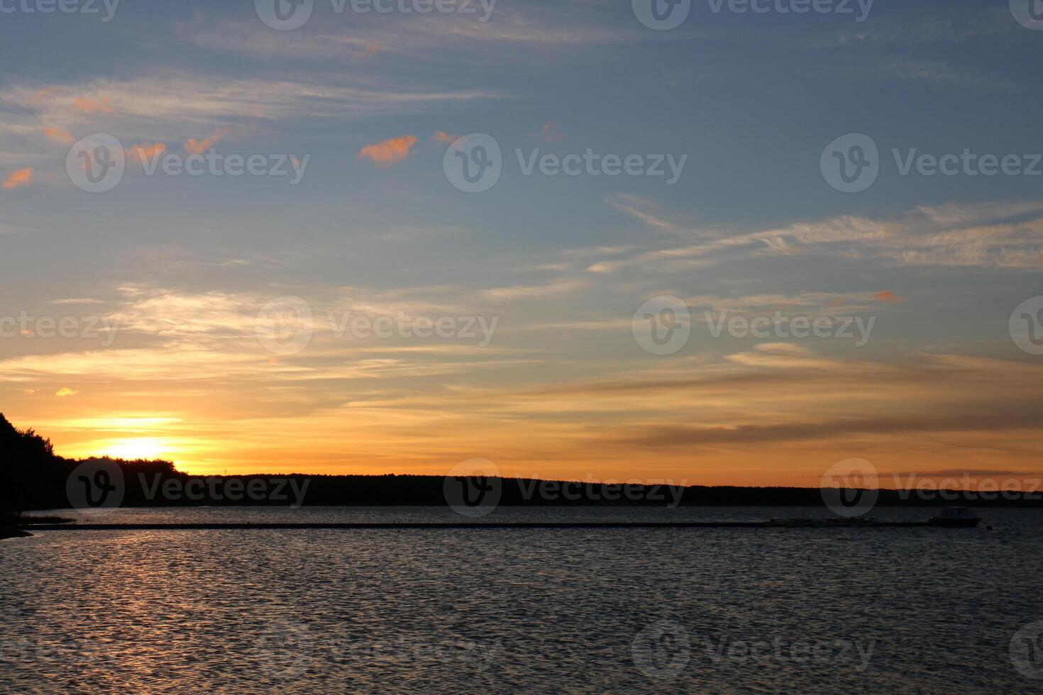 Lighting and color of the sky above the horizon at sunset. photo