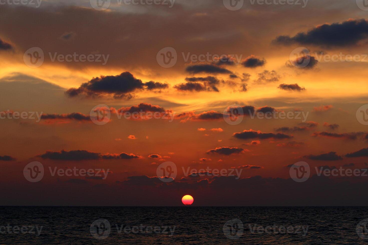 Lighting and color of the sky above the horizon at sunset. photo