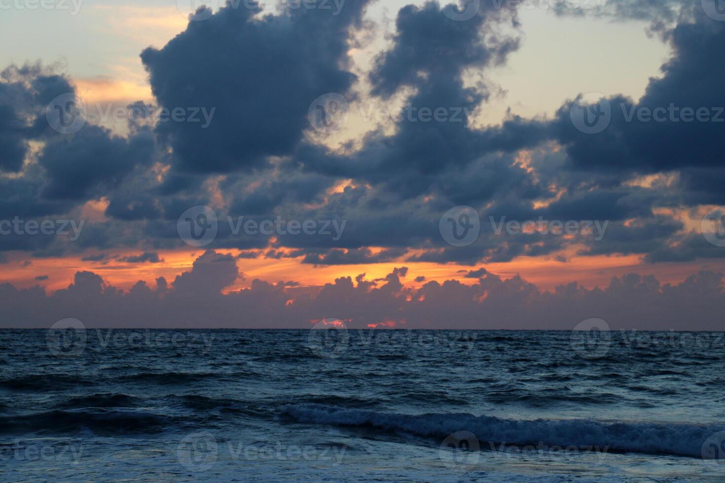 Lighting and color of the sky above the horizon at sunset. photo