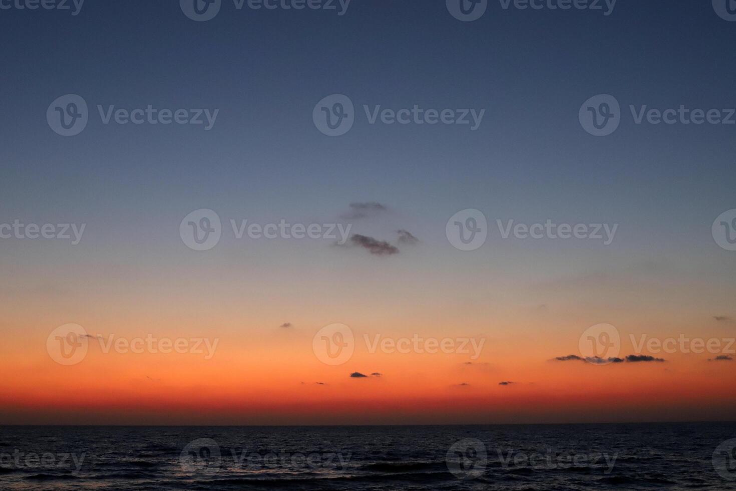 Lighting and color of the sky above the horizon at sunset. photo
