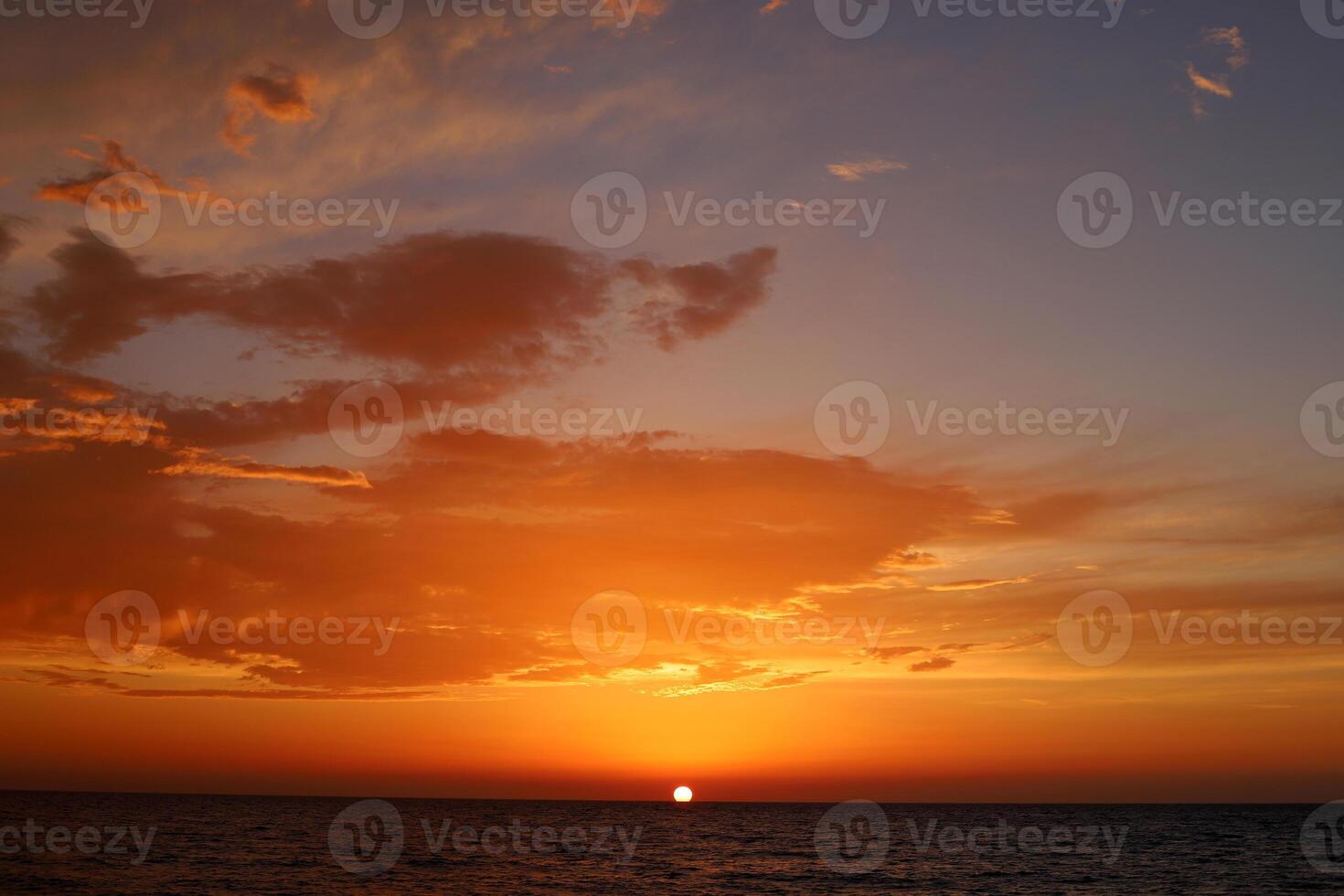 Lighting and color of the sky above the horizon at sunset. photo
