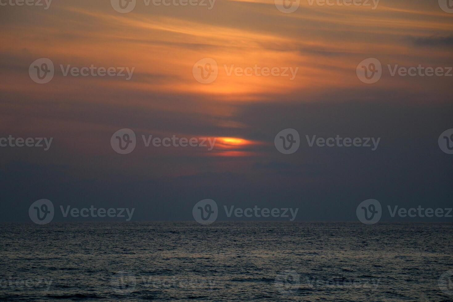 Lighting and color of the sky above the horizon at sunset. photo