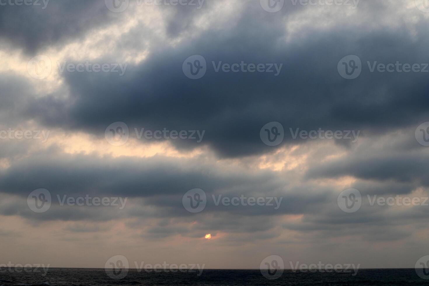 Lighting and color of the sky above the horizon at sunset. photo