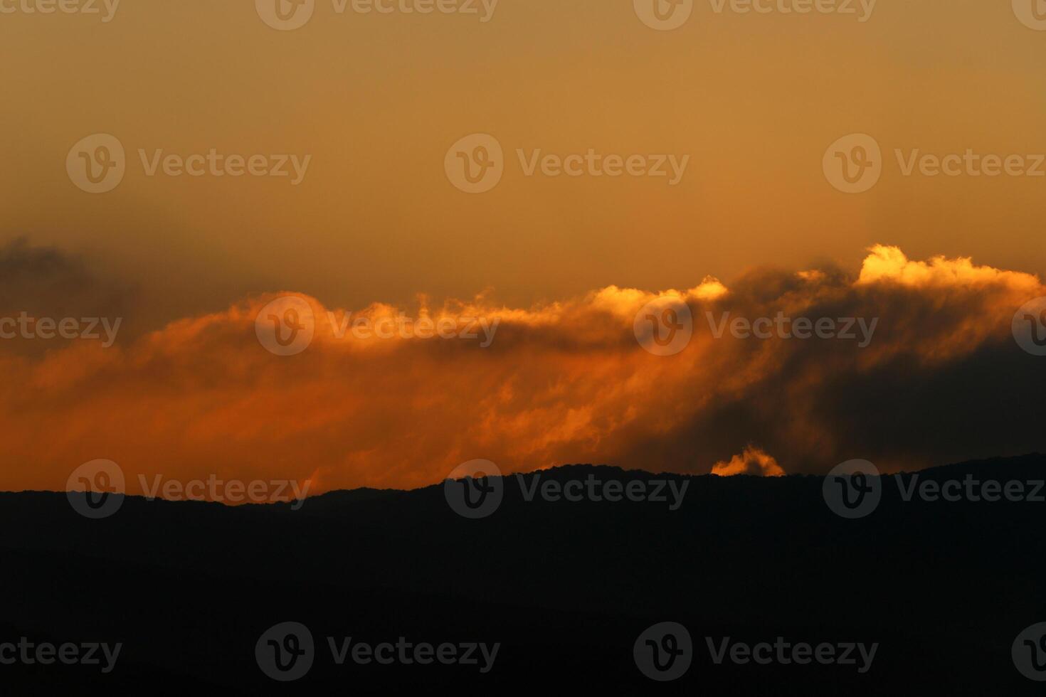 Lighting and color of the sky above the horizon at sunset. photo