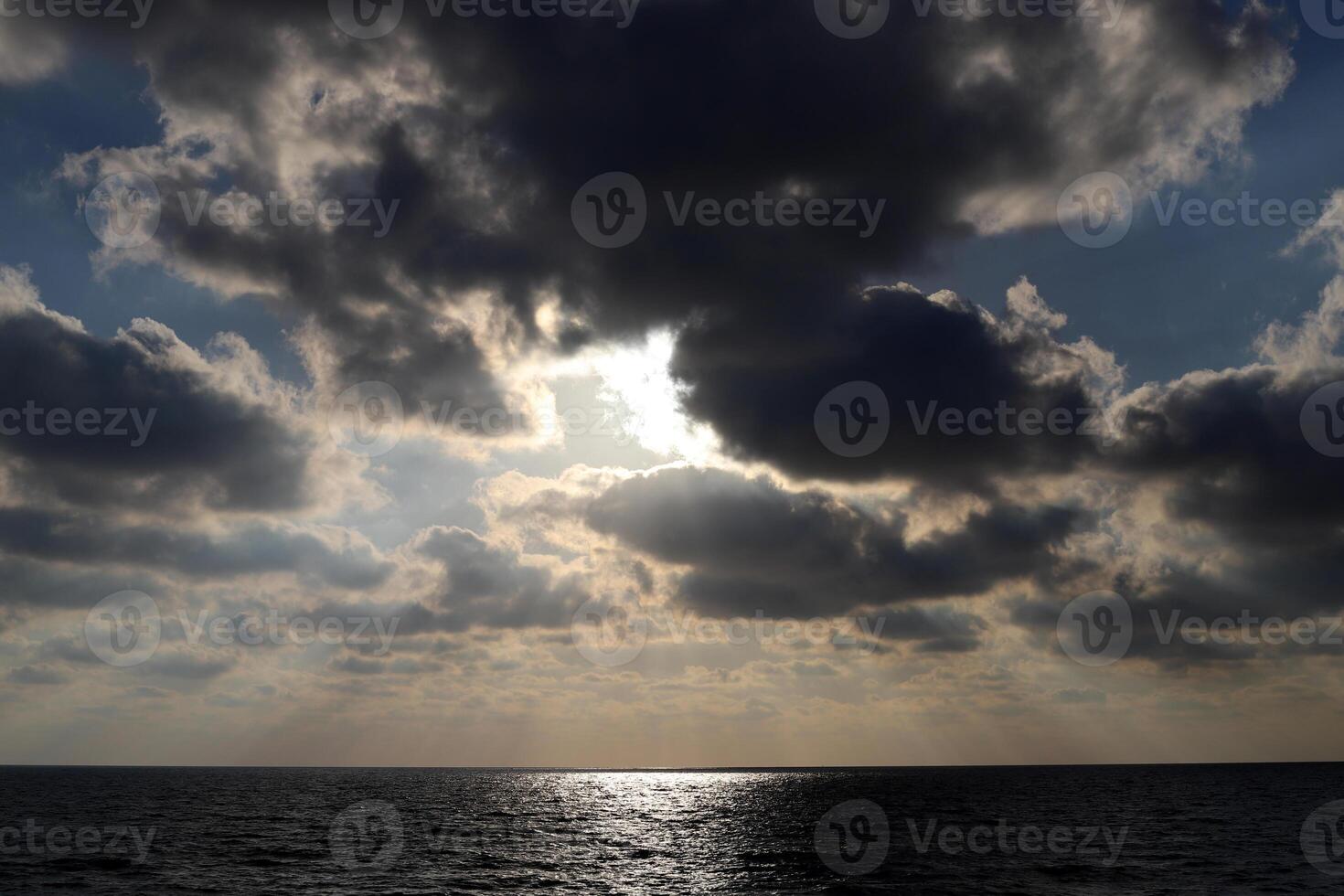 Rain clouds in the sky over the Mediterranean Sea. photo