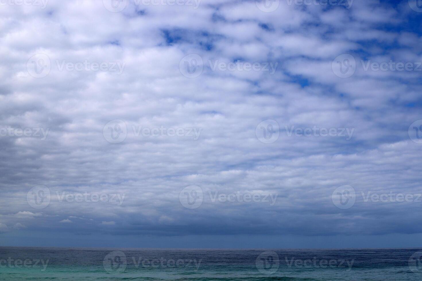 Rain clouds in the sky over the Mediterranean Sea. photo