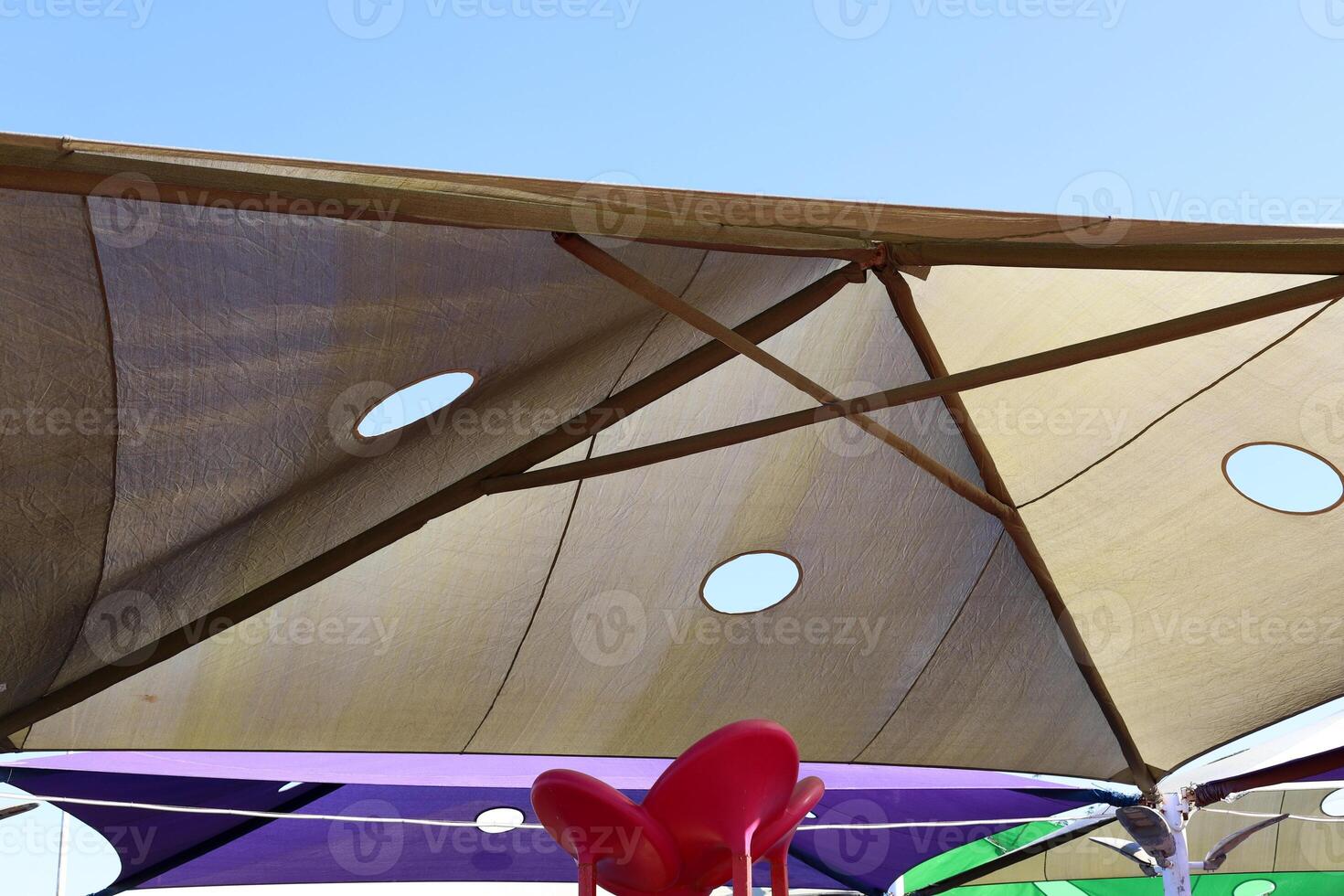 Canopy for protection from the hot sun in a city park. photo