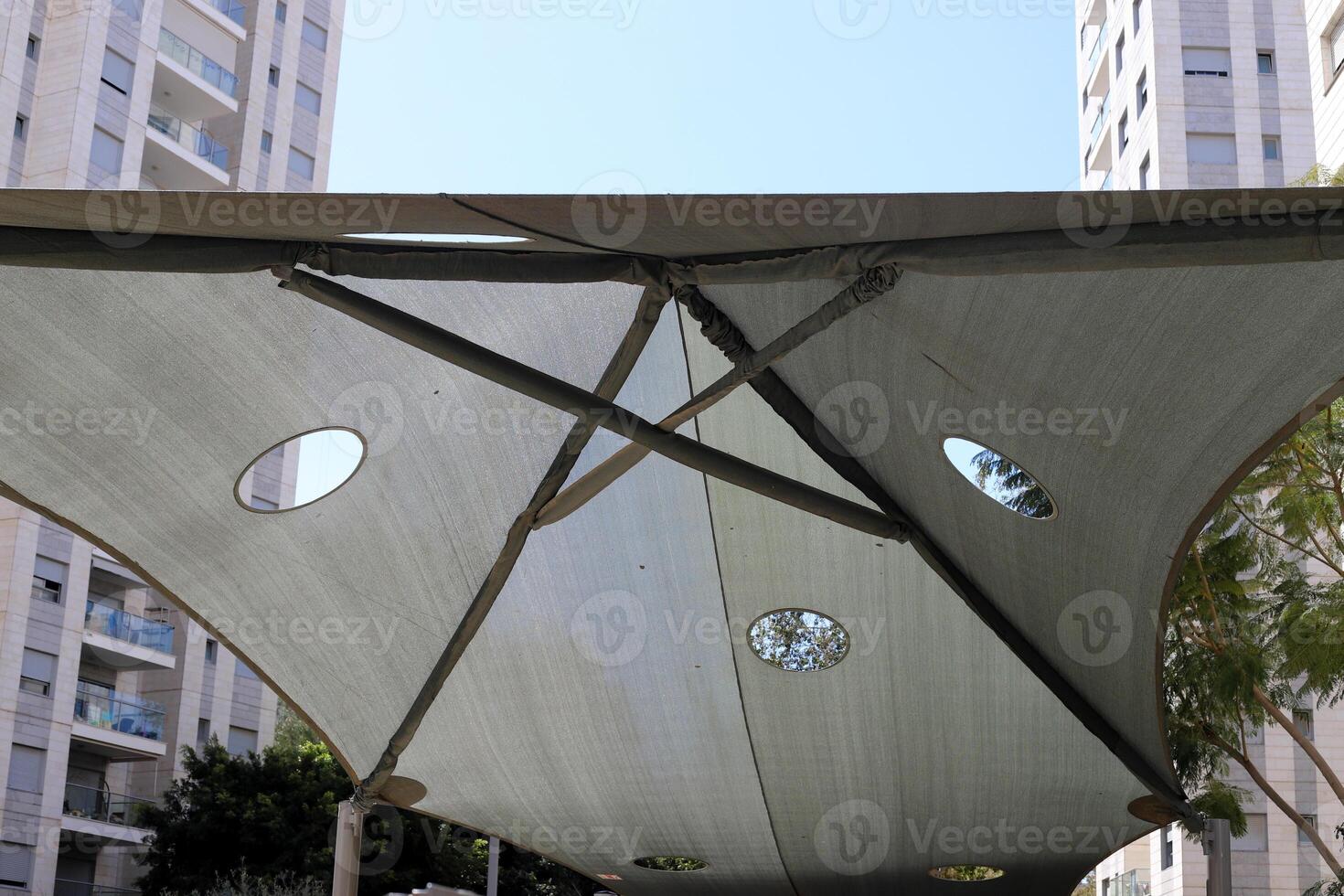 Canopy for protection from the hot sun in a city park. photo