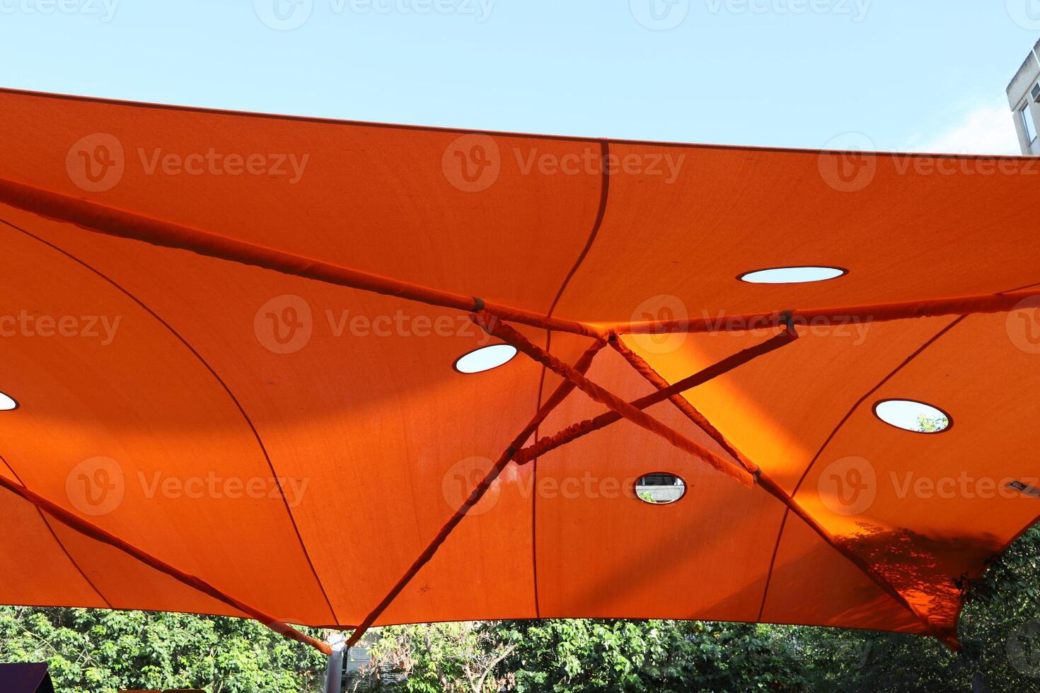 Canopy for protection from the hot sun in a city park. photo