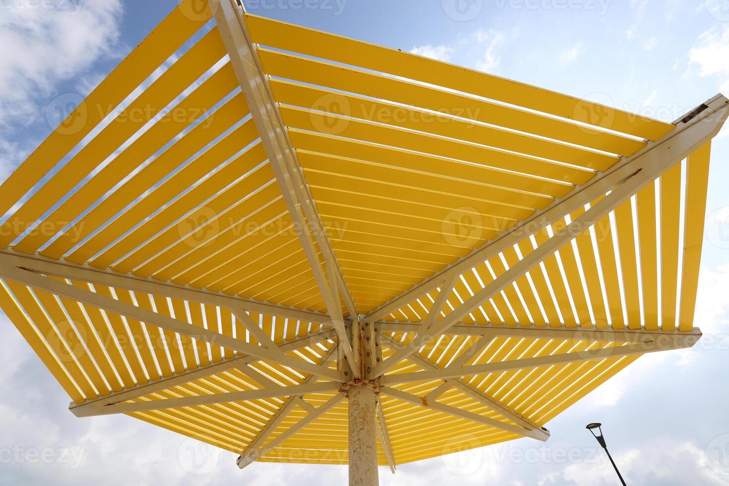 Canopy for protection from the hot sun in a city park. photo