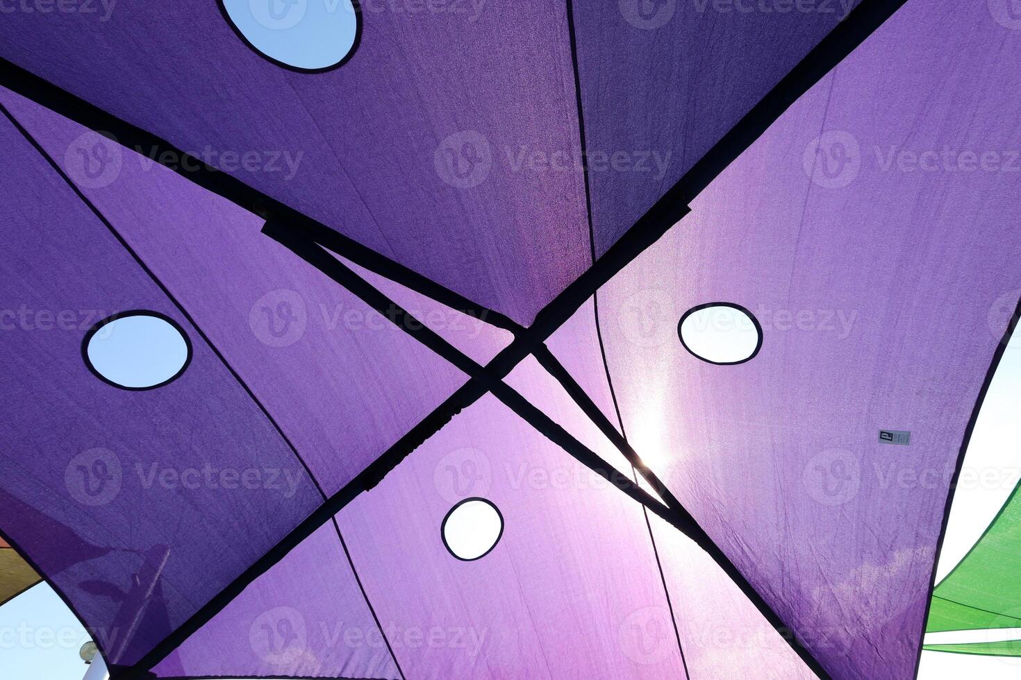 Canopy for protection from the hot sun in a city park. photo