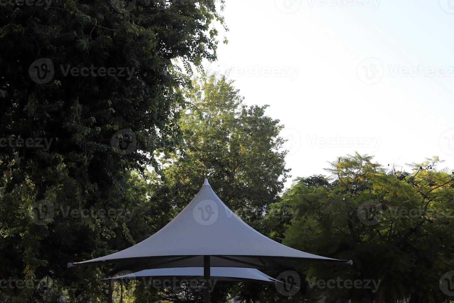 Canopy for protection from the hot sun in a city park. photo