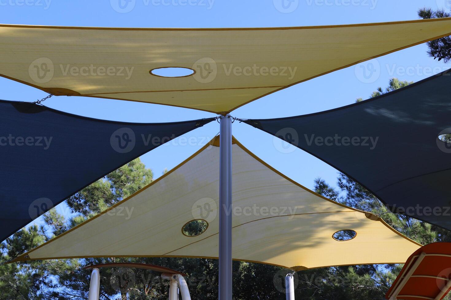 Canopy for protection from the hot sun in a city park. photo