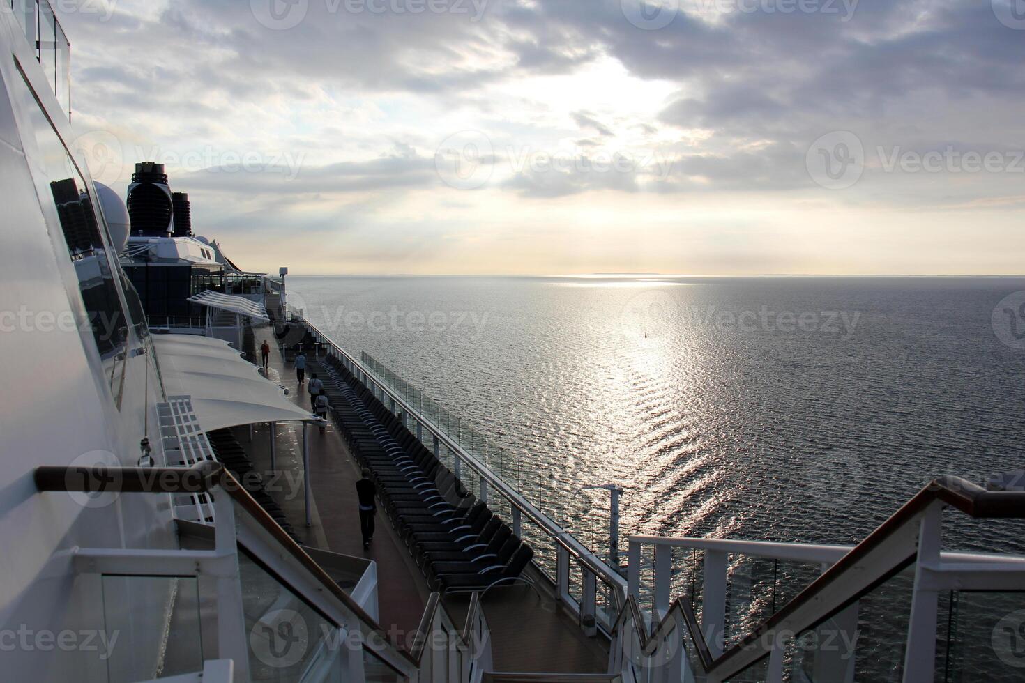 On the upper deck of a large ocean liner. photo