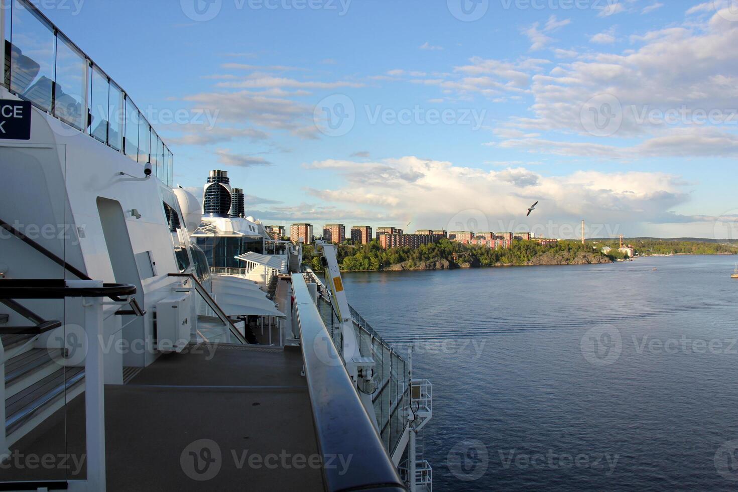 On the upper deck of a large ocean liner. photo
