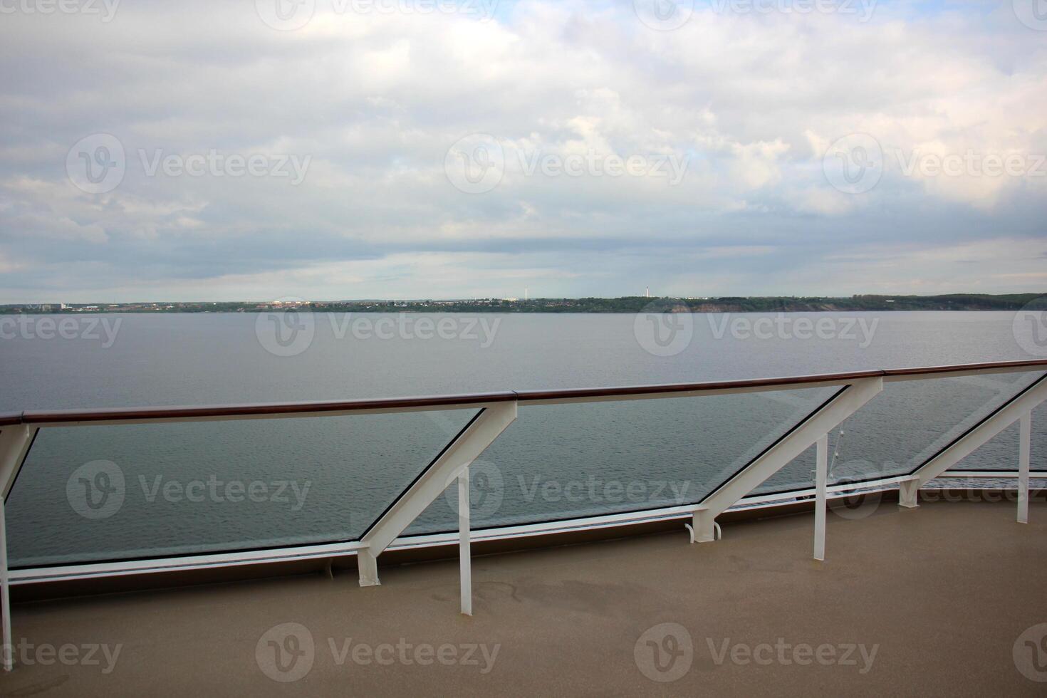 On the upper deck of a large ocean liner. photo