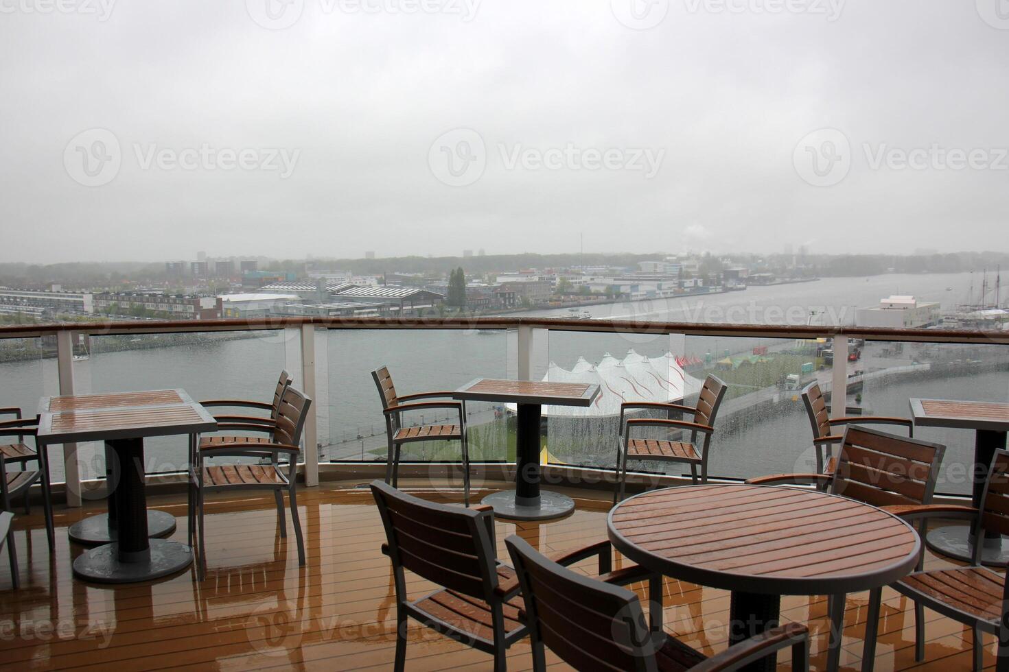 On the upper deck of a large ocean liner. photo