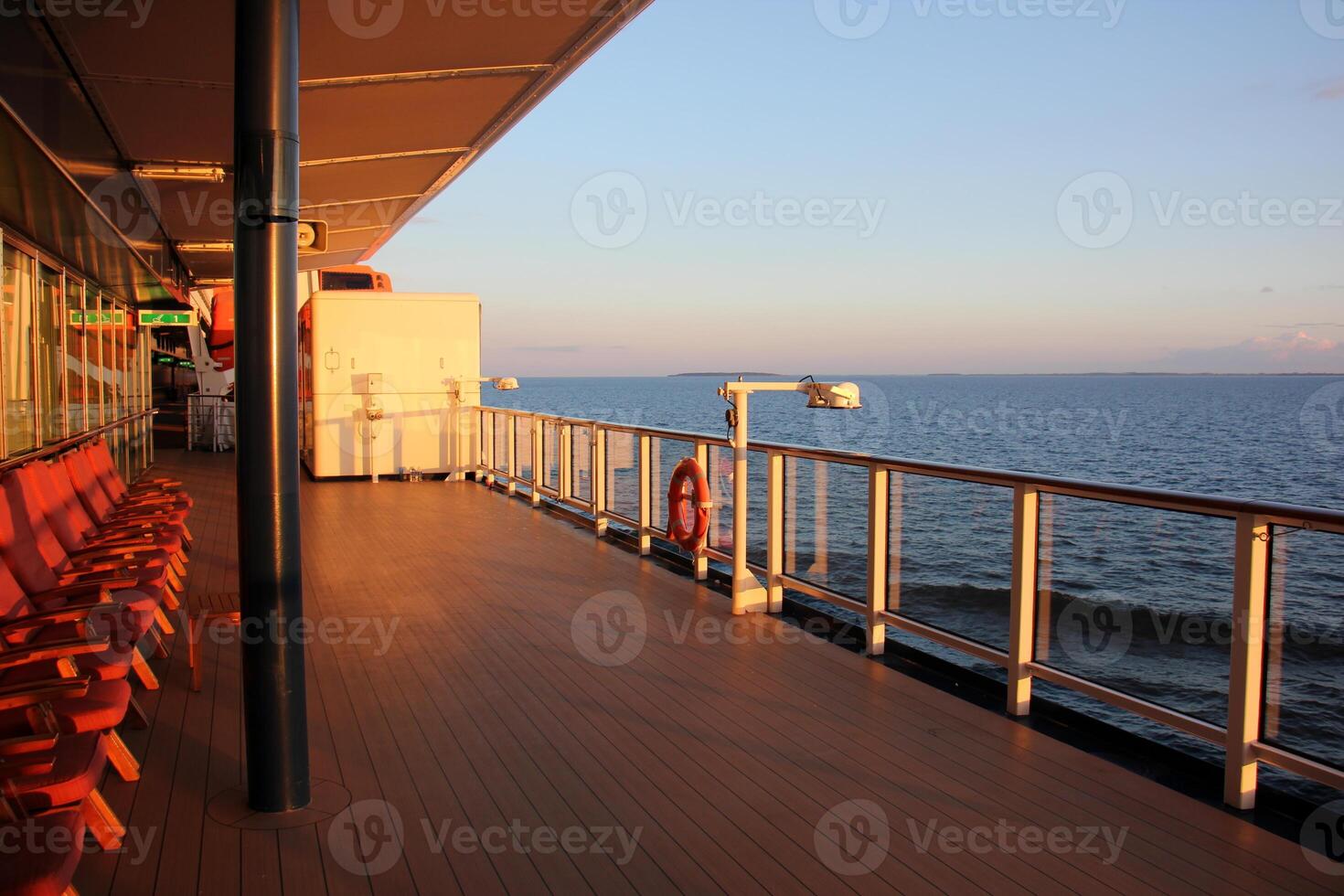 On the upper deck of a large ocean liner. photo