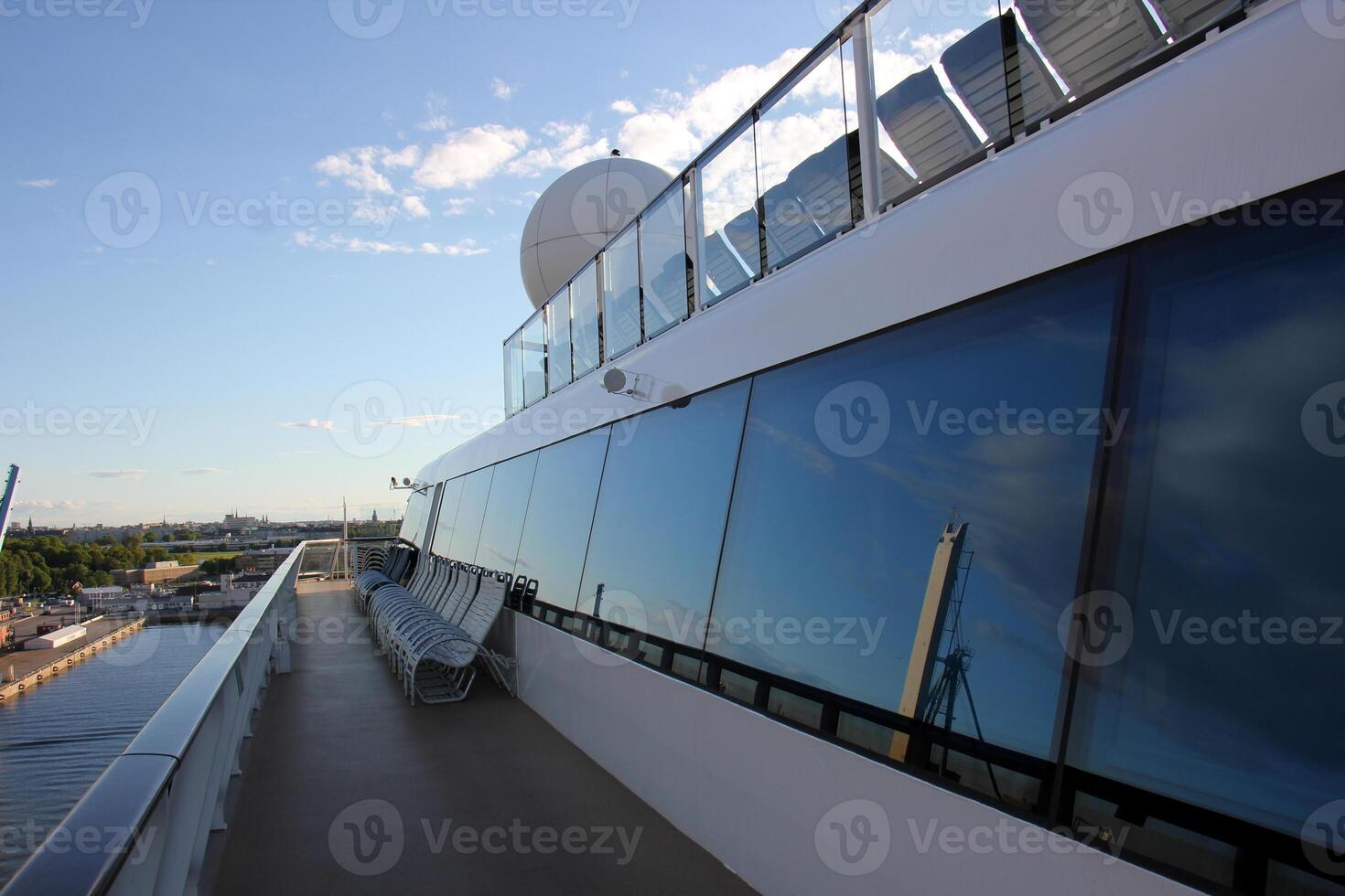 On the upper deck of a large ocean liner. photo