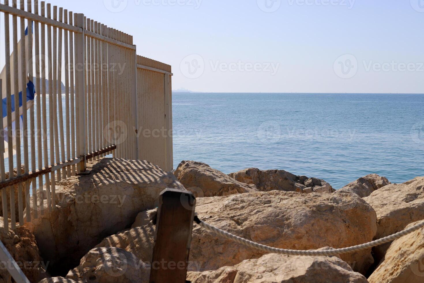 Stones and shells on the shore of the Mediterranean Sea. photo