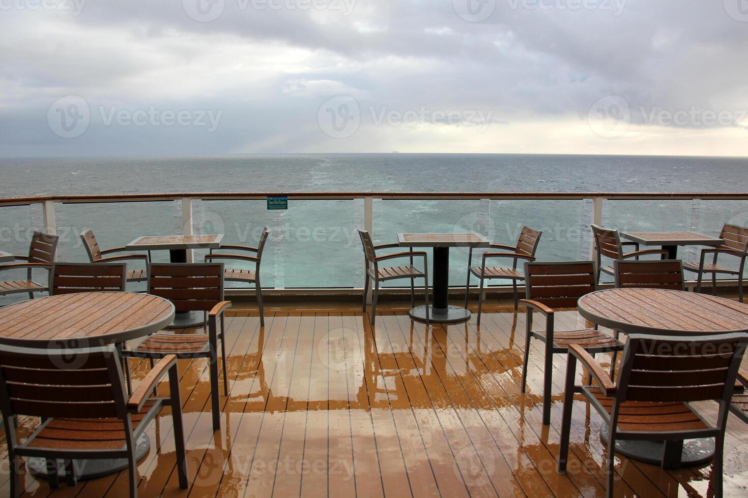 On the upper deck of a large ocean liner. photo