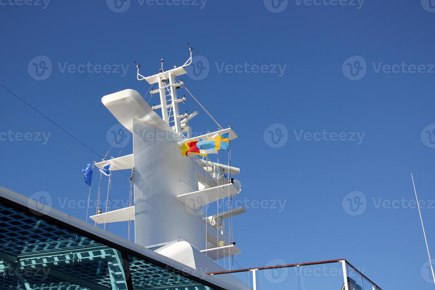 On the upper deck of a large ocean liner. photo