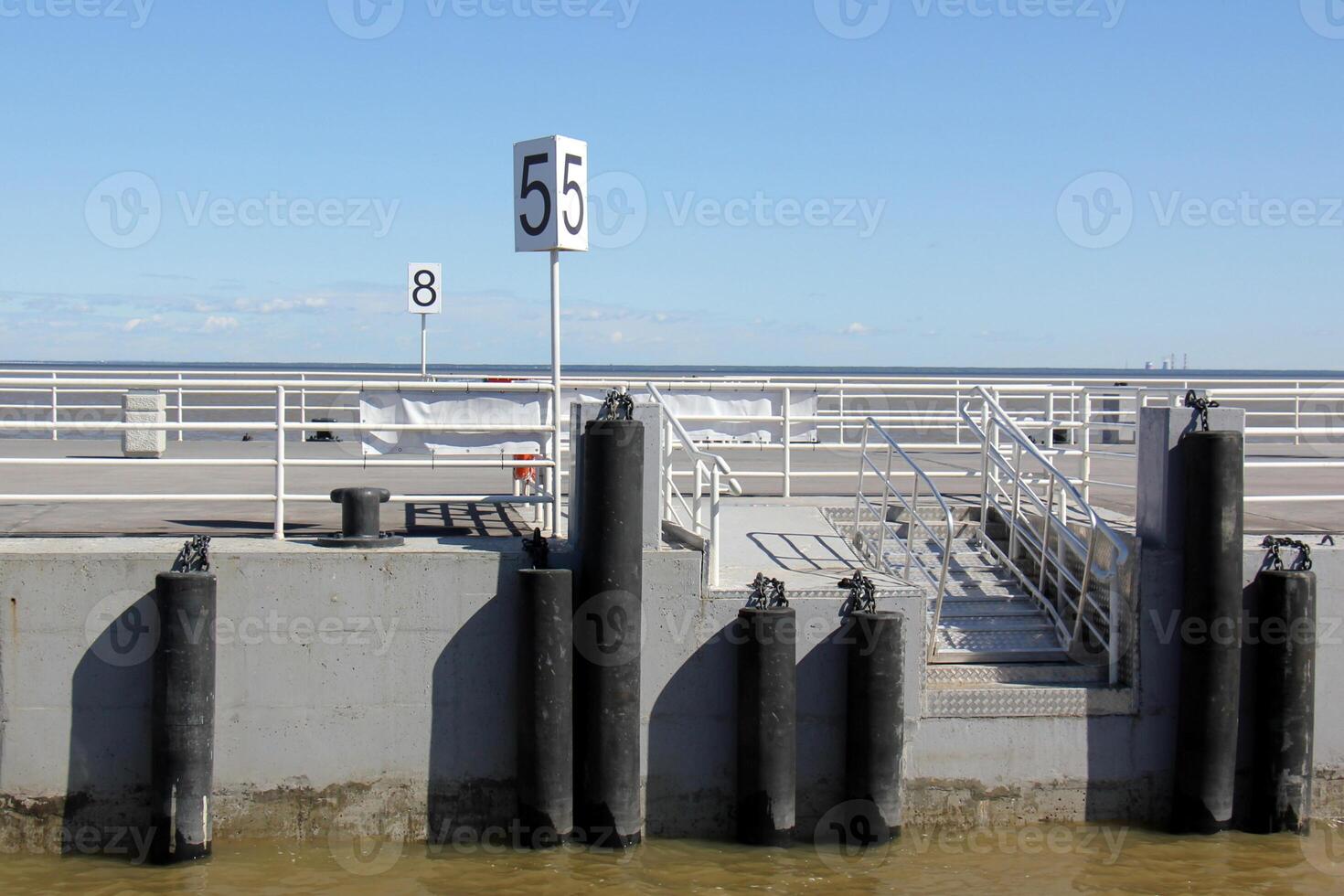 A pier on the shore for mooring boats and yachts. photo