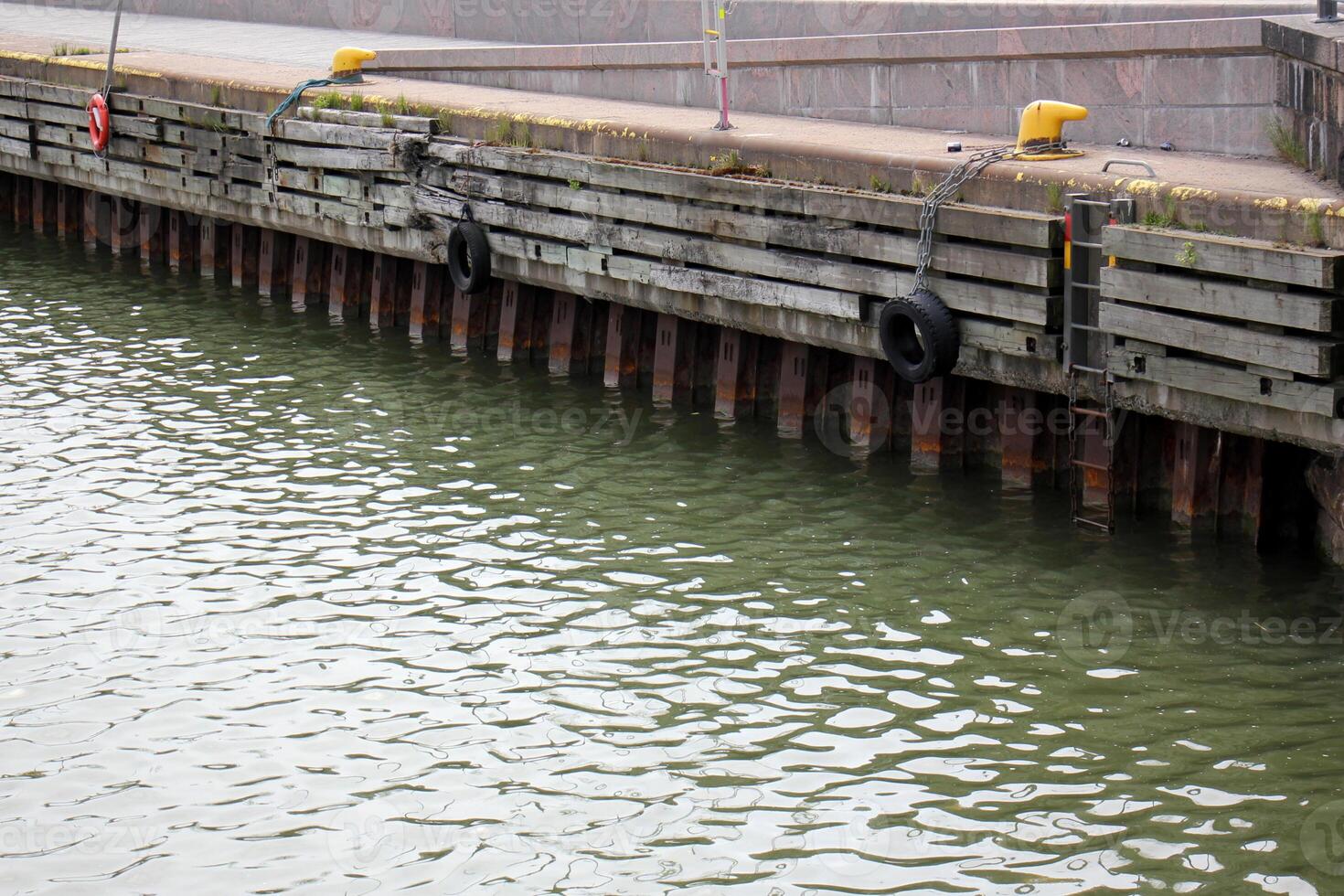 A pier on the shore for mooring boats and yachts. photo