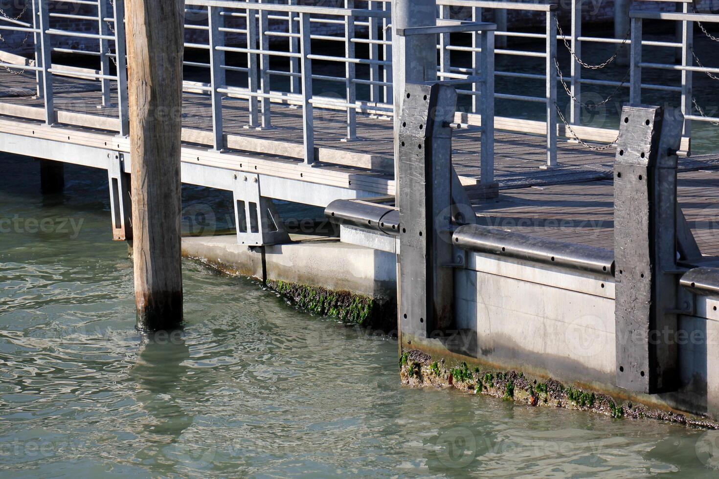 A pier on the shore for mooring boats and yachts. photo
