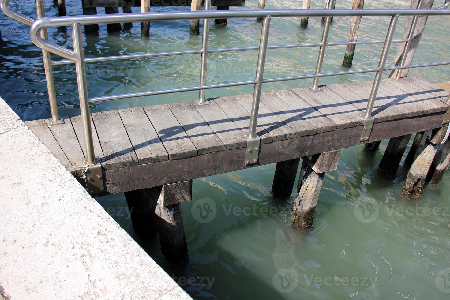 A pier on the shore for mooring boats and yachts. photo