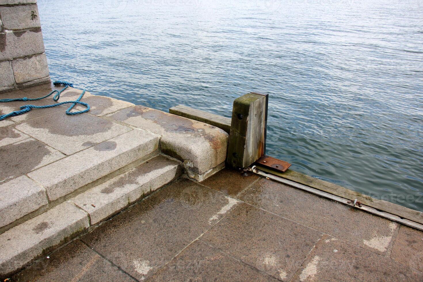 A pier on the shore for mooring boats and yachts. photo