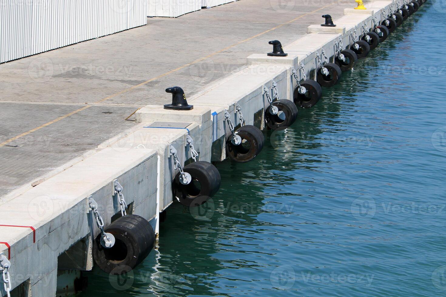 A pier on the shore for mooring boats and yachts. photo