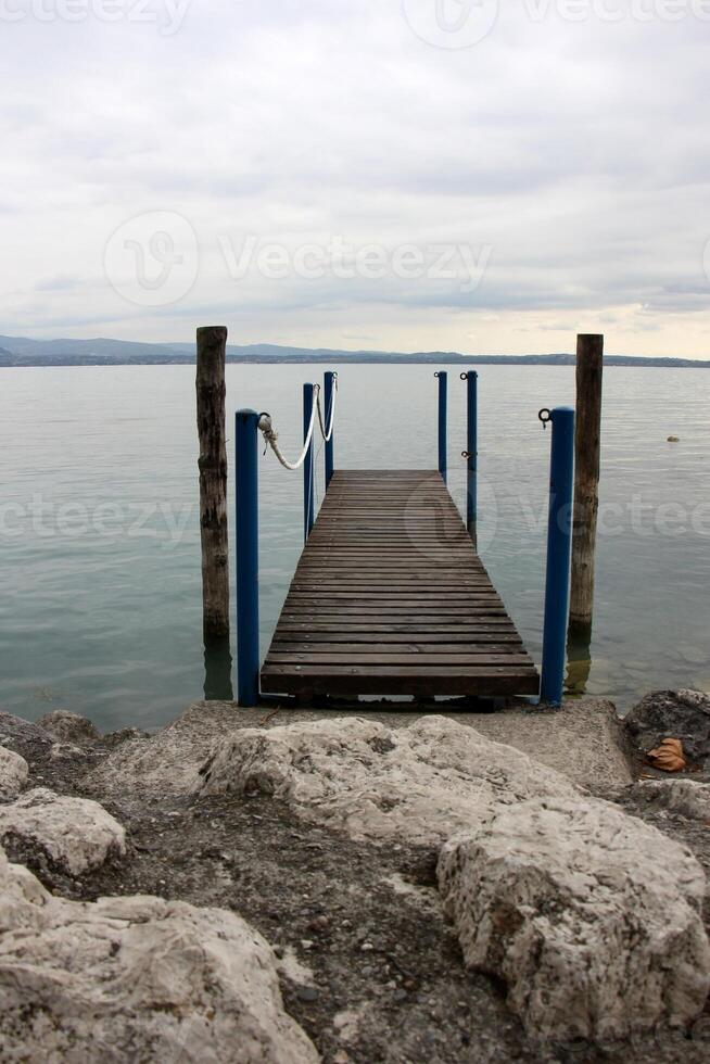 A pier on the shore for mooring boats and yachts. photo