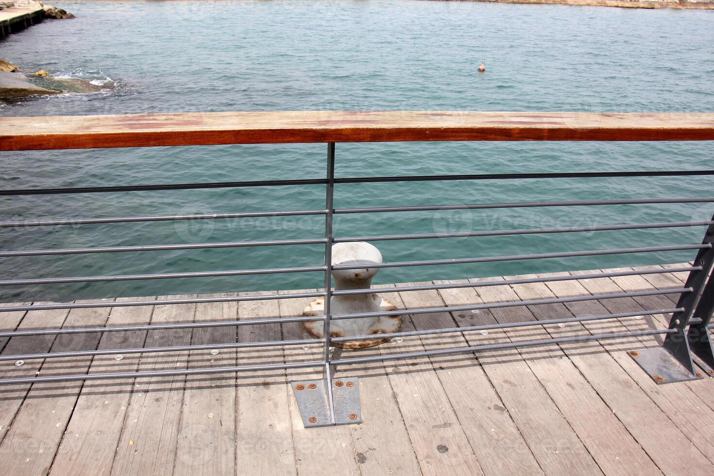 A pier on the shore for mooring boats and yachts. photo