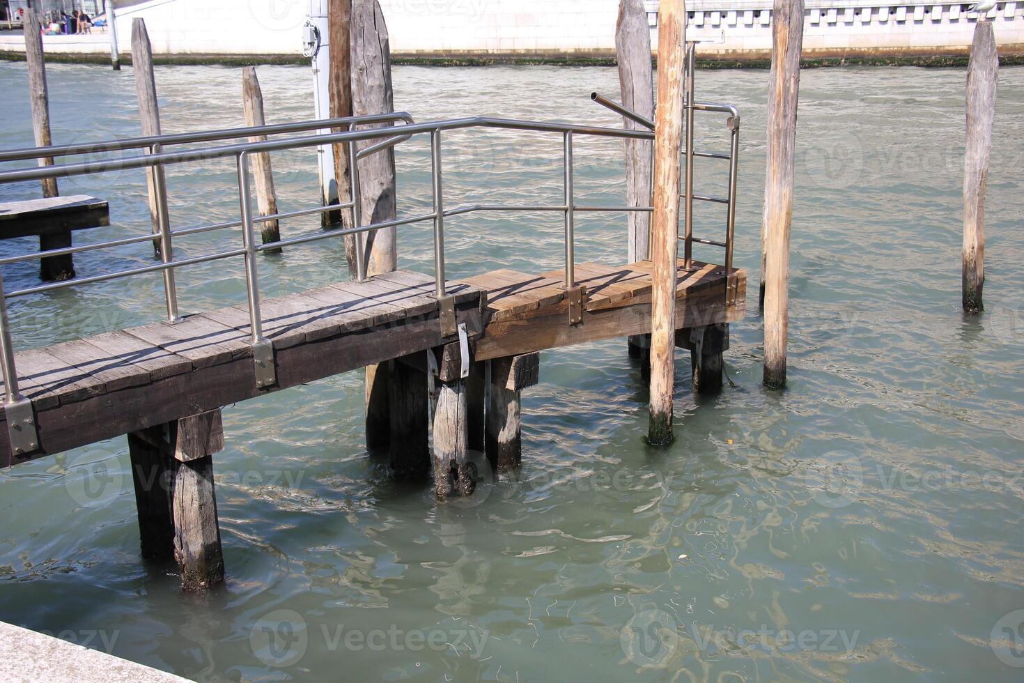 A pier on the shore for mooring boats and yachts. photo