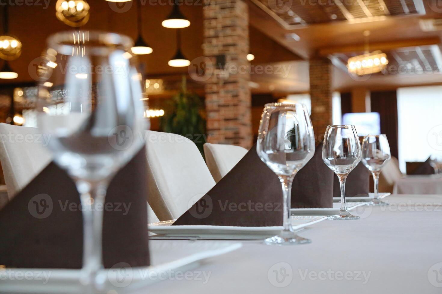 Table Set With Wine Glasses and Plates for a Formal Dinner photo