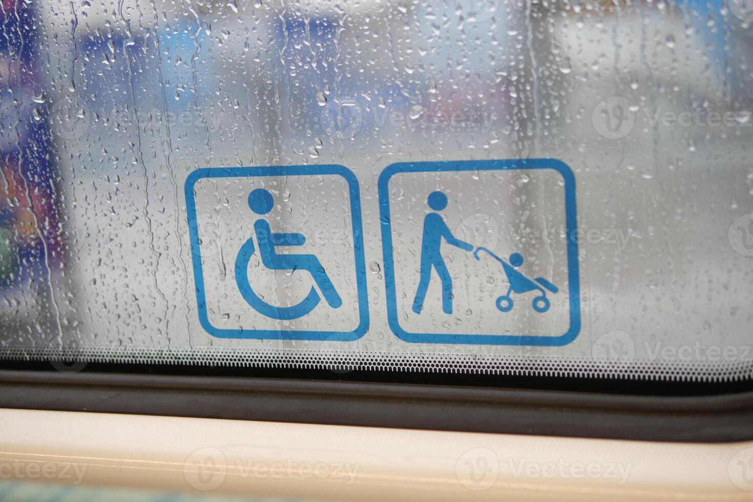 Disability sign on the door of a subway car photo