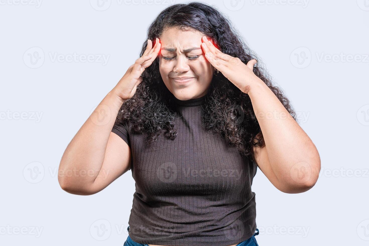 Young woman with headache isolated. Girl suffering from migraine holding head. Headache concept photo