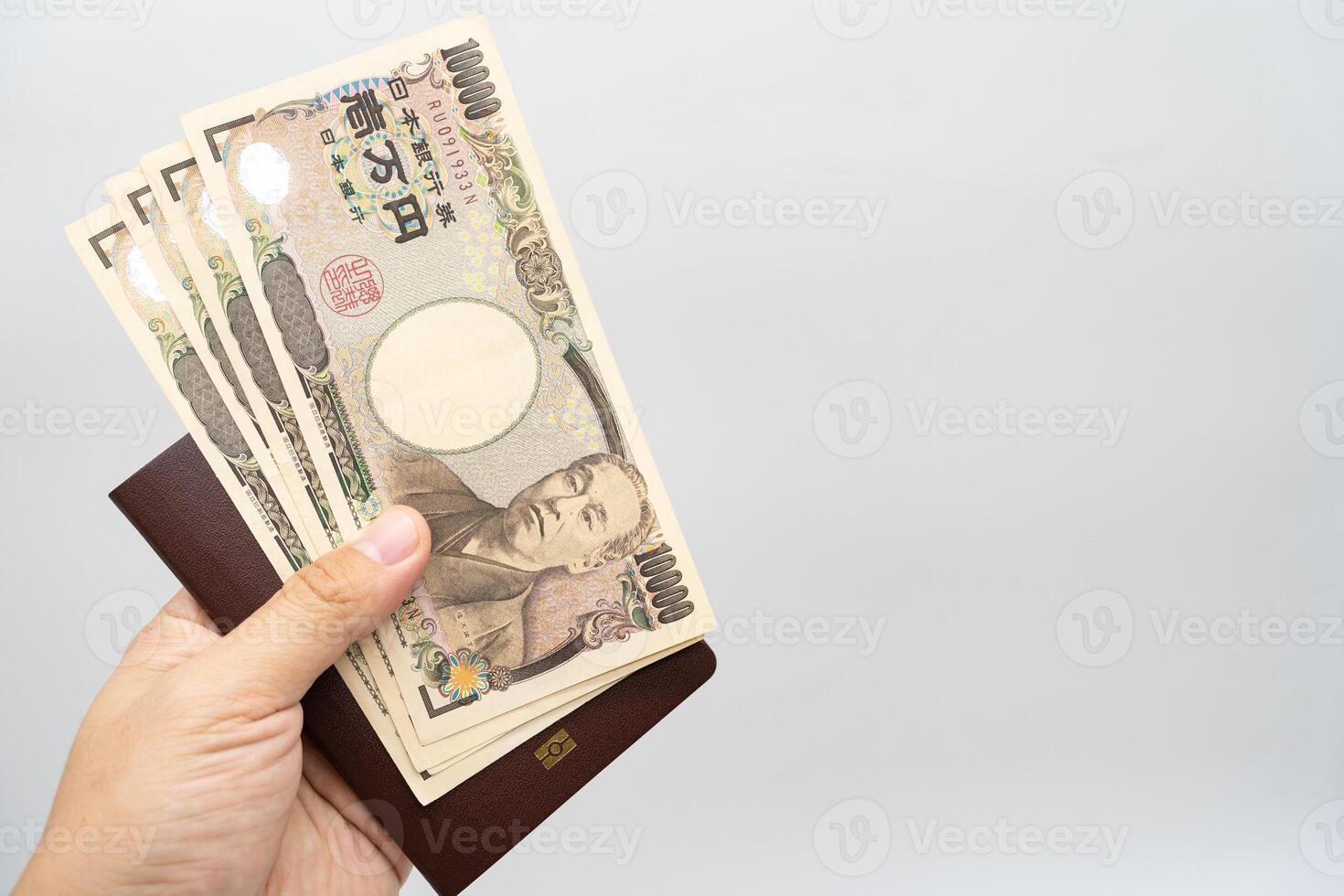 Thai passport and japan money for travel on isolated background with copy space. Thai people prepared for vacation to Japan. photo