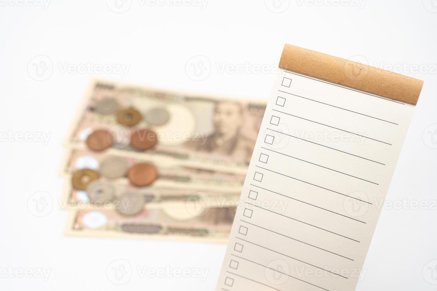 Blank to do list for text with checkbox and Japanese money. vacation, planning budget. travel plan concept. photo