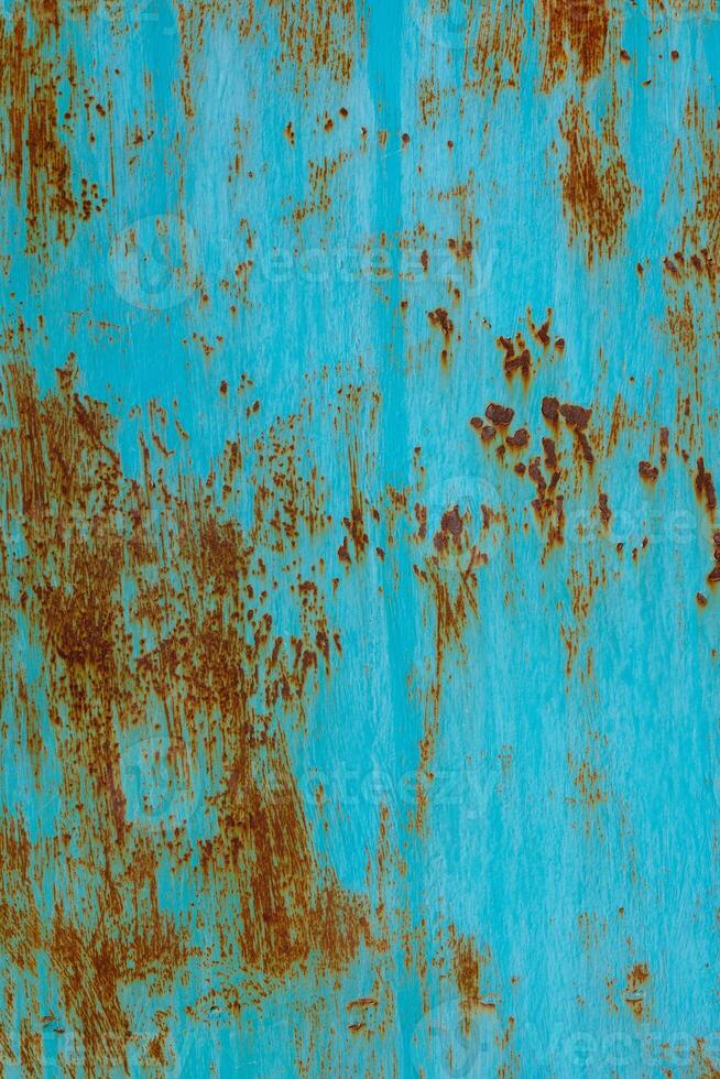 turquoise painted steel surface with stains of rust - full-frame background and texture photo