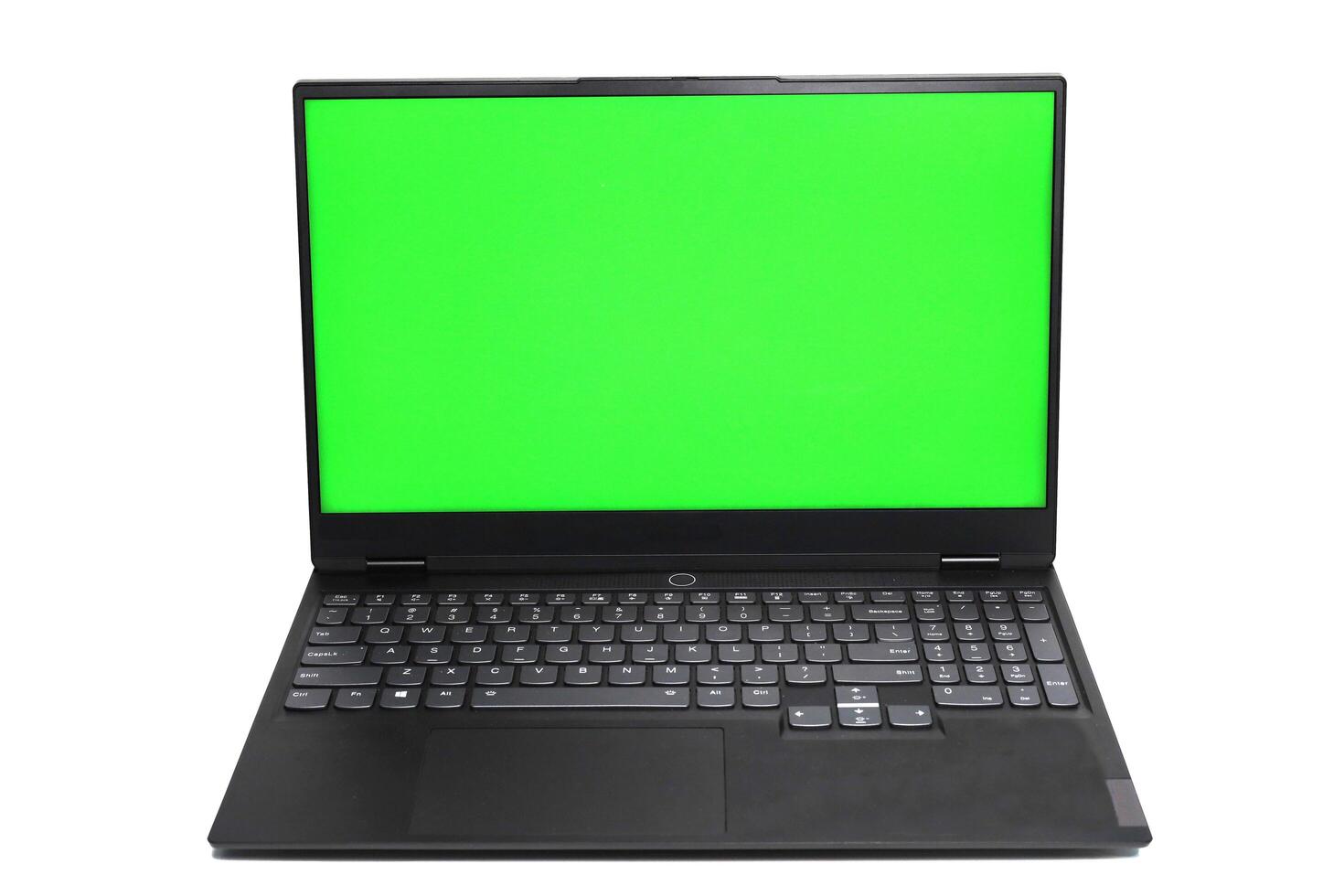 Laptop with green screen isolated with empty space on white background photo