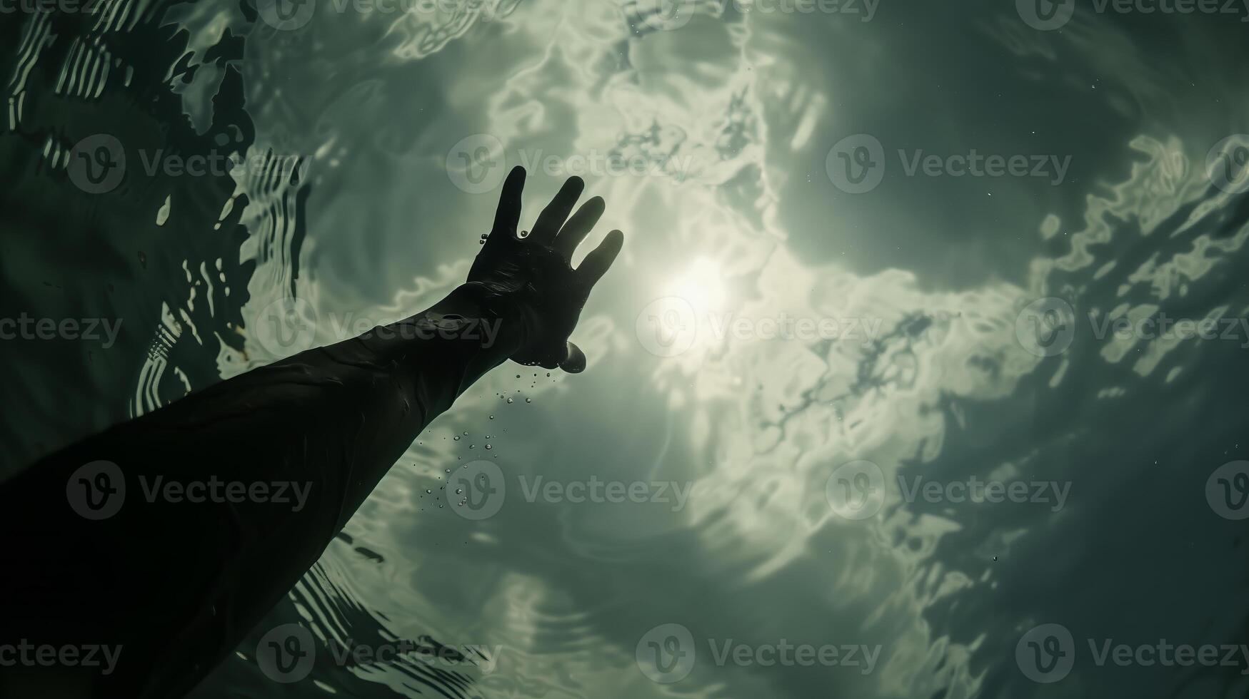 Hand reaching to the cloudy sky from under the water , hand of god photo