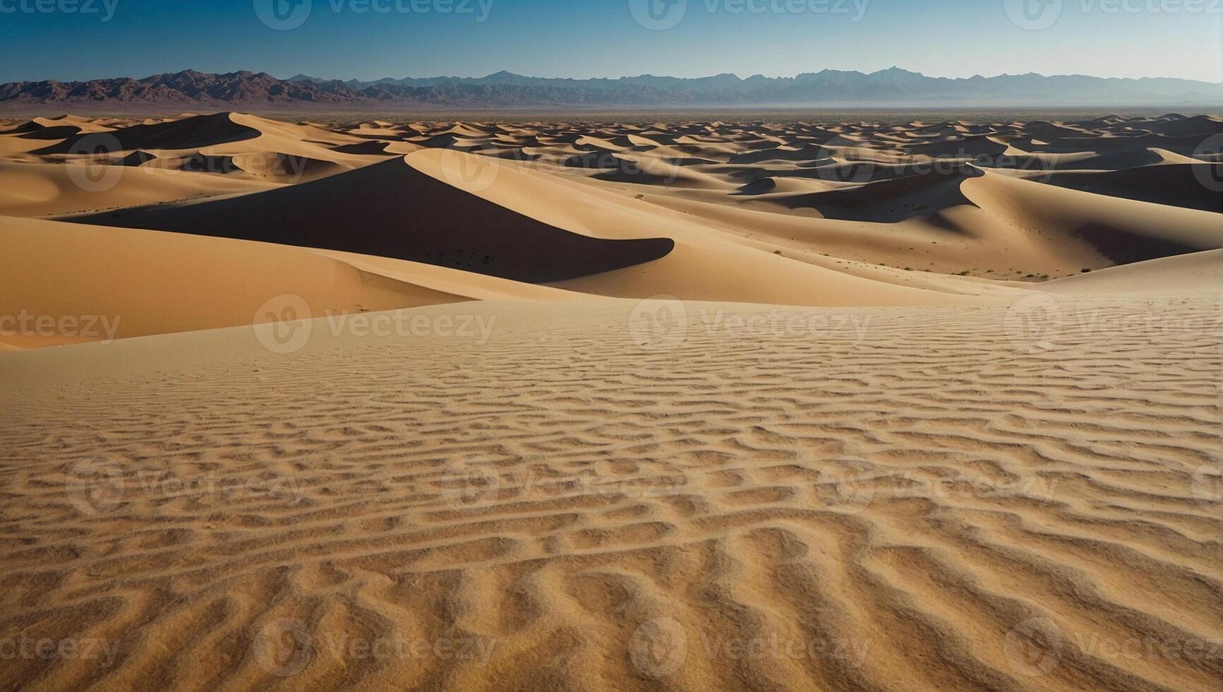 Tranquility in the peaceful desert where the vast expanse of golden sands stretches endlessly beneath a clear blue sky photo