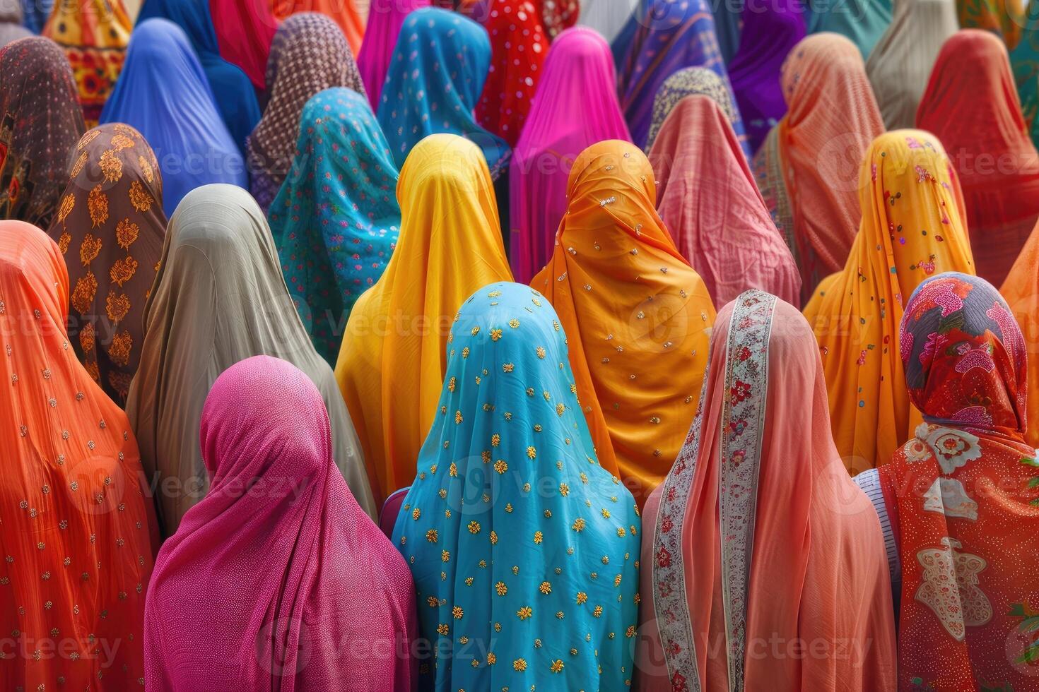 Crowd of women in vibrant traditional dresses photo