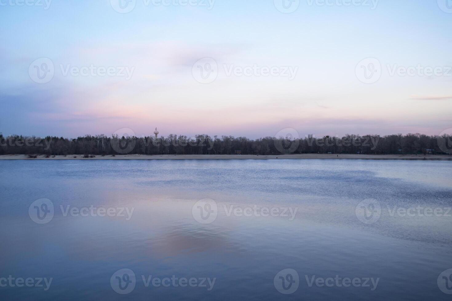 Sunset over the lake at winter. photo