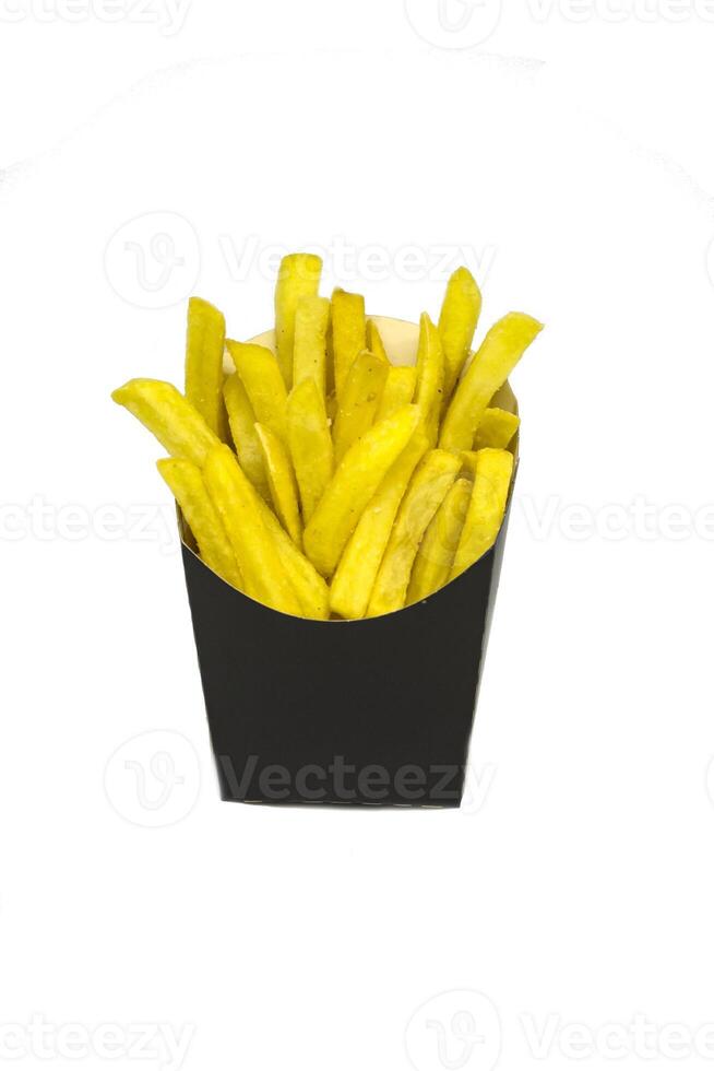 French fries in a black paper wrapper isolated on white background photo