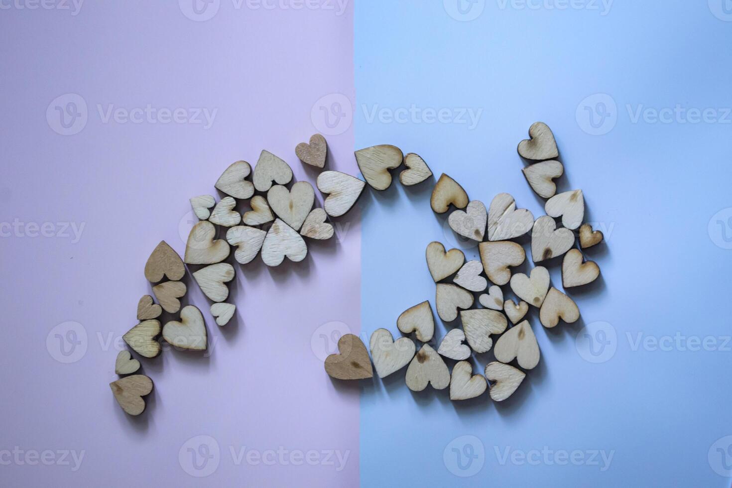 Decorative wooden hearts on a table. photo